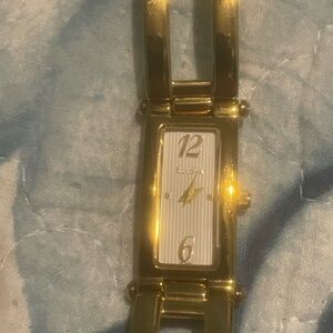 Bulova Gold Timepiece with White Face